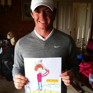 Golfer Rory McIlroy with his signed Jack Draws Anything portrait